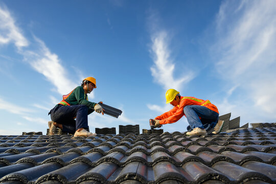 Technician performing roof repairs